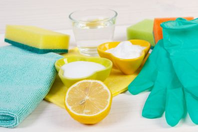 natural cleaning products including vinegar, lemon and baking soda