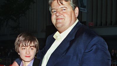 Daniel Radcliffe, left, who plays Harry Potter in the new movie "Harry Potter and the Sorcerer's Stone," and Robbie Coltrane, who plays Hagrid in the film, arrive for the film's New York premiere on Nov. 11, 2001. 