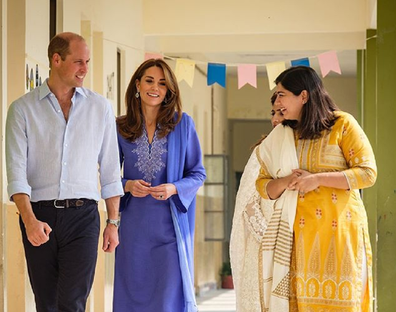 The couple were lead through the school by staff members.