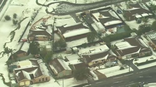 NSW Central Coast yards and roads were blanketed in hail. (9NEWS)