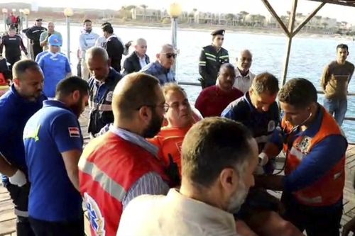 On Tuesday, Nov. 26, 2024, rescuers transport a survivor after a tourist yacht sank in the Red Sea, in Marsa Alam, Egypt.