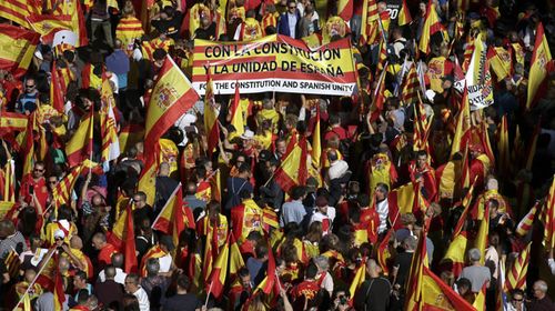Spanish PM vows to fight Catalan breakaway as huge rally forms