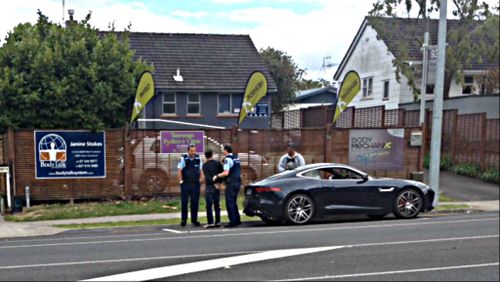 AC/DC drummer Phil Rudd is arrested outside Tauranga Girls' College on New Zealand's North Island. (SunLive.co.nz)