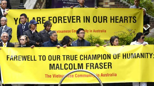 Mourners from the Vietnamese community pay their respects. (AAP)