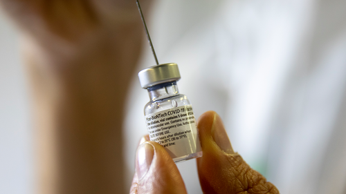 A healthcare professional prepares a Pfizer-BioNTech COVID-19 vaccine at a vaccination center in Jerusalem.  (AP Photo / Ariel Schalit)