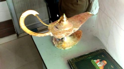 This photo, released by Uttar Pradesh Police, shows the lamp that a doctor purchased for $130,000 after allegedly being tricked it was magic and could bring wealth and happiness.