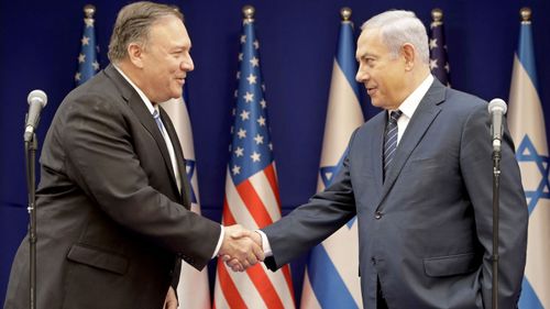 U.S. Secretary of State Mike Pompeo, left, shakes hands with Israeli Prime Minister Benjamin Netanyahu, during a meeting at the Prime Minister's residence in Jerusalem