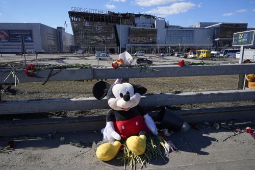 Toys and flowers lie in front of the Crocus City Hall on the western outskirts of Moscow, Russia, Wednesday, March 27, 2024.  