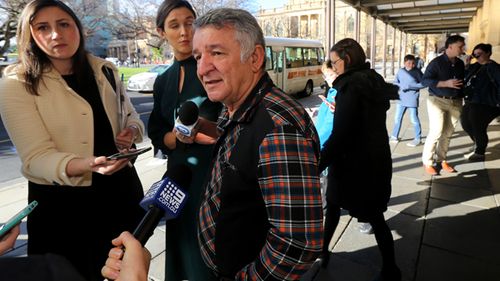 Victim Enver Shabanay speaks to the media outside the District Court in Adelaide. Financial adviser James David Gibbs has been jailed for at least seven years after systematically stealing the life savings of his clients.