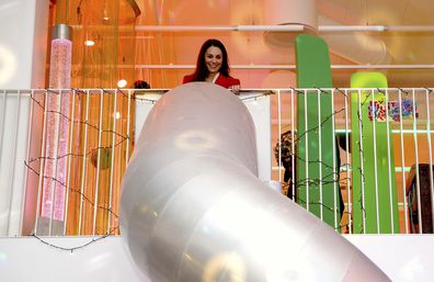 Kate, Duchess of Cambridge stands at the top of a slide before using it at the Lego Foundation PlayLab on Campus Carlsberg in Copenhagen, Tuesday, Feb. 22, 2022.