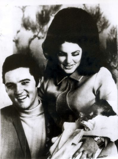 Priscilla and Elvis Presley with baby daughter Lisa Marie.