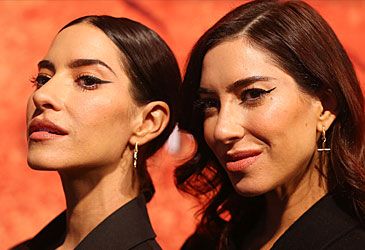 Which song was Jess and Lisa Origliasso's debut single as the Veronicas?