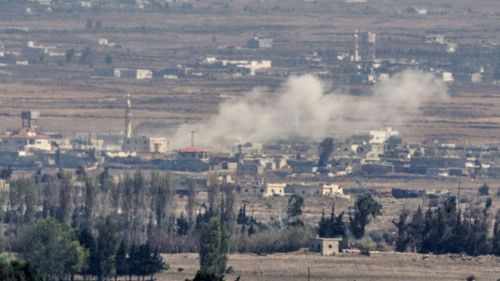 Smoke billows from a Syrian village of Quneitra during fighting. (Getty Images)