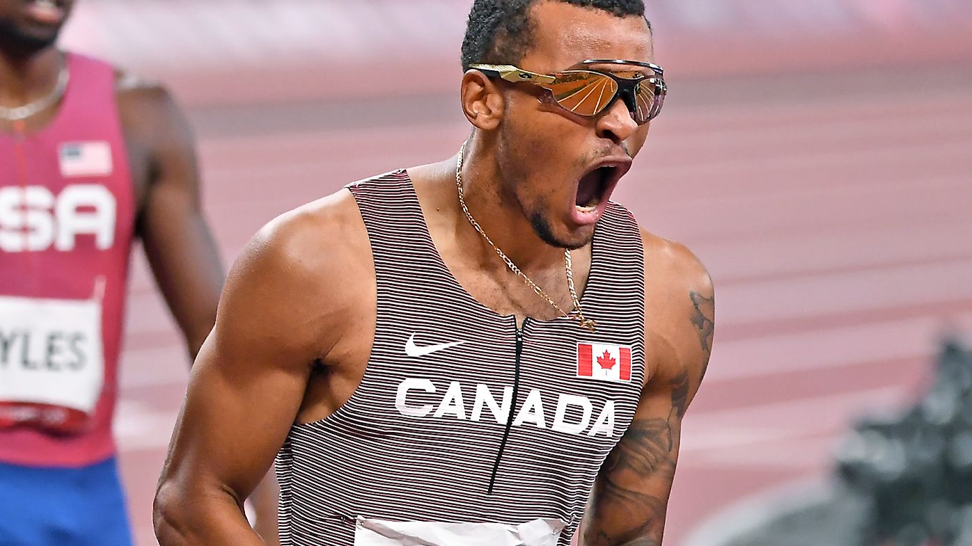 Canadas Andre de Grasse celebrates the gold medal in the 200m final at the 2020 Tokyo Olympics.