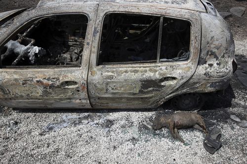 Rescue parties have been searching through charred homes and cars for survivors. Picture: AAP.