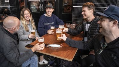 Surry Hills locals enjoy a drink at the Dolphin Hotel as the COVID-19 lockdown ends. 