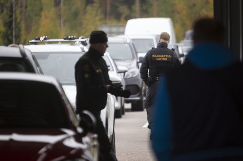 Finnish border guards check the cars at the Vaalimaa border check point between Finland and Russia in Virolahti, Eastern Finland Wednesday, Sept. 28, 2022. 