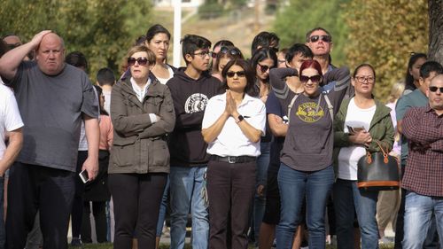 Parents wait to reunite with their children.