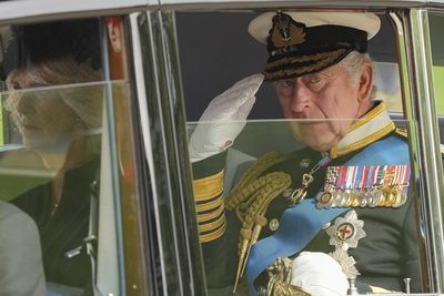 King Charles salutes the crowd following his mother's state funeral