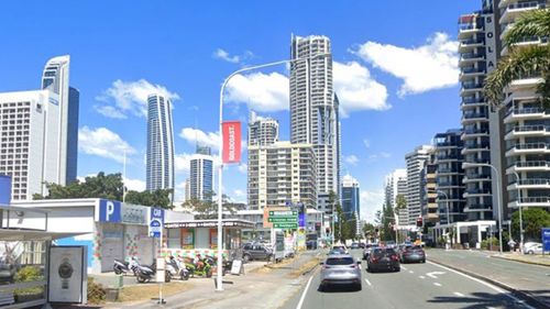 Three men were shot at, one was injured on Ferny Avenue in Surfers Paradise.