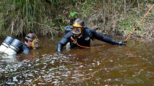 NSW Police divers search a dam as the search continues for evidence of missing boy William Tyrrell, on day three, near Bonny Hills on the NSW mid-north coast, Wednesday, March 4, 2015.