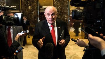Former New York City Mayor Rudy Giuliani speaks to reporters at Trump Tower, in New York City.