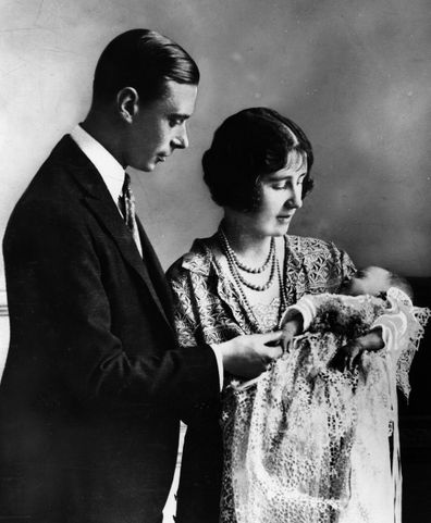 Future King and Queen, George, Duke of York and Elizabeth Duchess of York holding their first child, future Monarch Princess Elizabeth at her christening ceremony. 