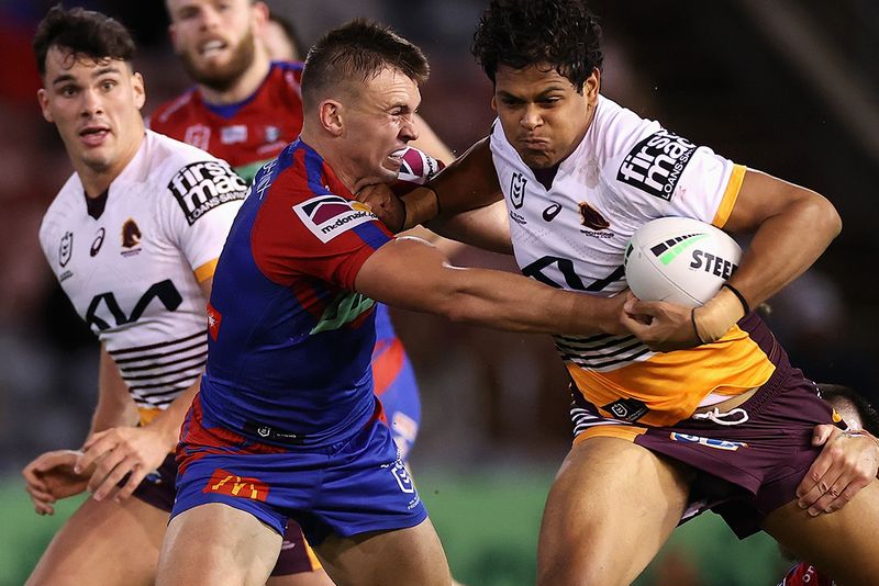 Selwyn Cobbo of the Broncos is tackled during the round 11 NRL match between the Newcastle Knights and the Brisbane Broncos.