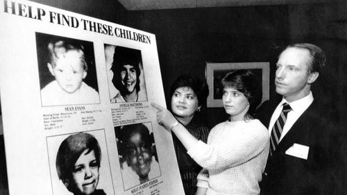 Jennifer Matthews, 16, points to a photo of her missing sister, Jonelle, 13, as parents Gloria and Jim Matthews, of Boulder, Colorado, look on.