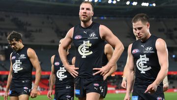 MELBOURNE, AUSTRALIA - AUGUST 27: Harry McKay and his Blues team mates look dejected after losing the round 24 AFL match between Carlton Blues and Greater Western Sydney Giants at Marvel Stadium, on August 27, 2023, in Melbourne, Australia. (Photo by Quinn Rooney/Getty Images)