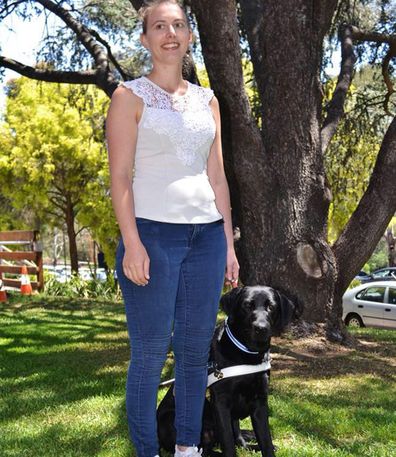 Steph with guide dog, Rocky.