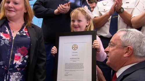 Georgia Ritter was all smiles when she walked onstage to accept her award. (9NEWS)