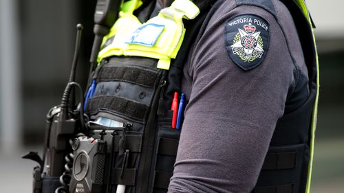 Members of Victoria Police attend a protest in Melbourne. Generic police officers uniform badge logo. Photo by Paul Rovere