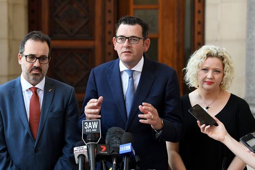 Victorian Premier Daniel Andrews is joined by Minister for Health Jill Hennessy (right), and State Attorney-General Martin Pakula (left) outside Parliament House for a press conference after an assisted dying vote today. (AAP)