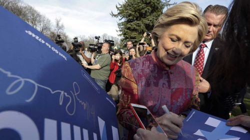 Hillary Clinton signs autographs after voting in Chappaqua, New York. (AAP)