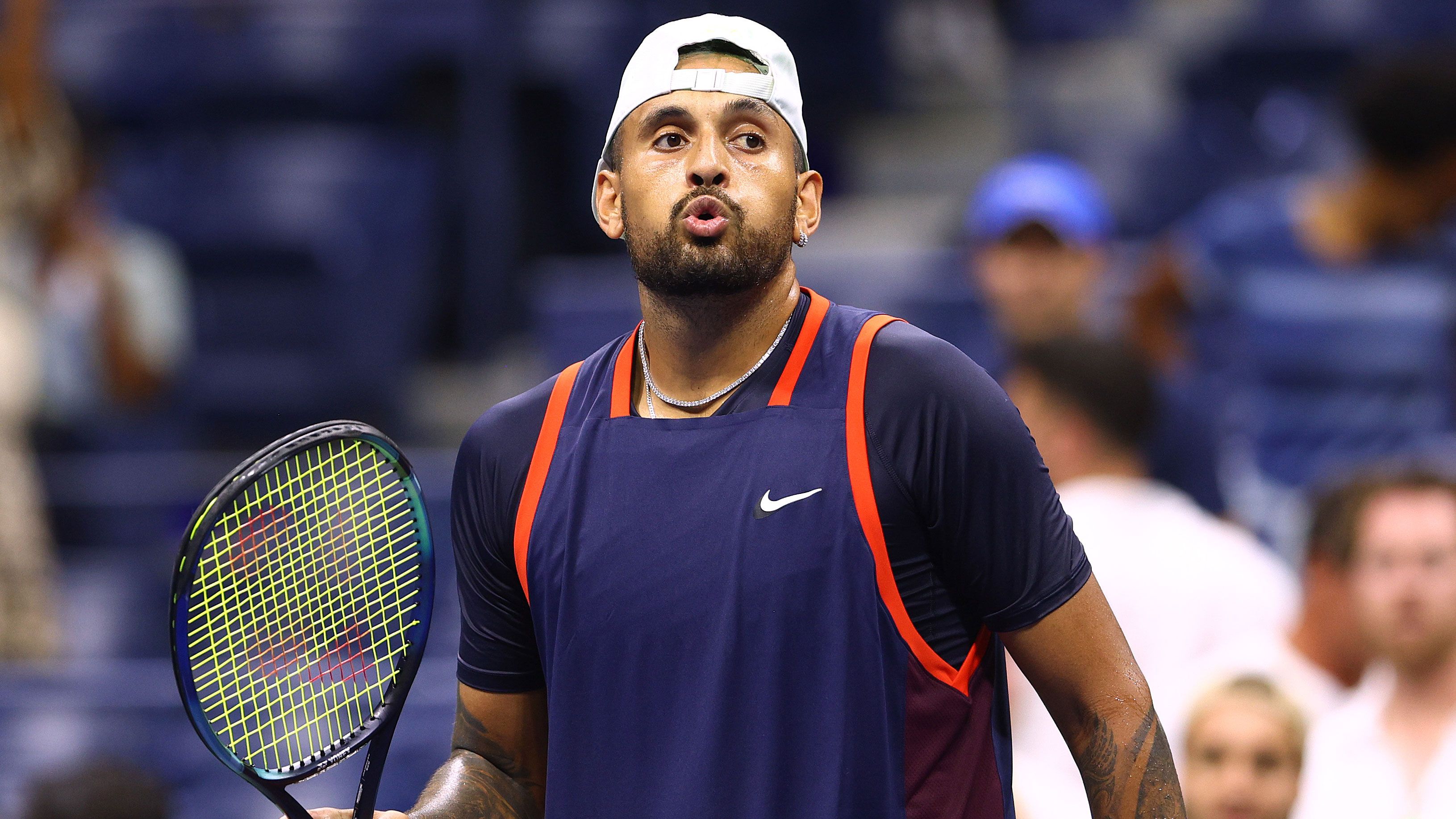 Nick Kyrgios reacts after defeating best mate Thanasi Kokkinakis in the first round of the 2022 US Open.