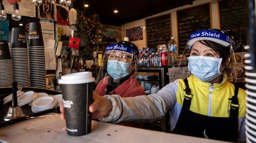 Sydney cafe workers serve customers during the coronavirus pandemic.