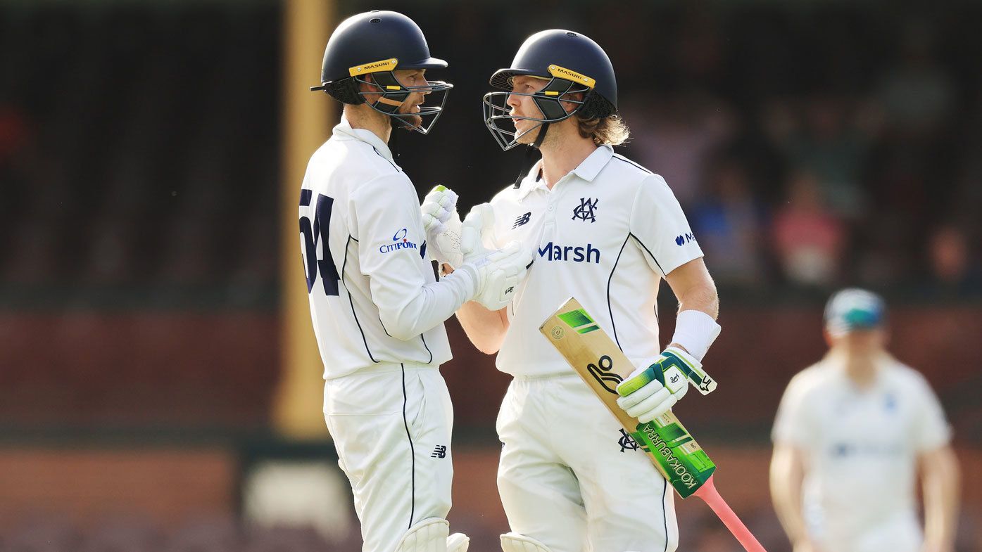 Will Pucovski is congratulated by Peter Handscomb after scoring a century for Victoria.