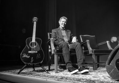NASHVILLE, TENNESSEE - OCTOBER 28: (Editors Note: Image has been converted to black & white) Country artist Randy Travis is seen onstage at the Ryman Auditorium on October 28, 2019 in Nashville, Tennessee. (Photo by Jason Kempin/Getty Images)