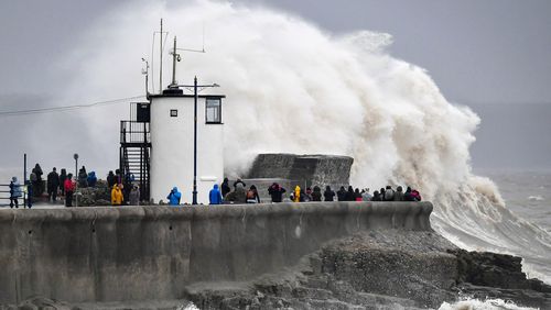 Two die in rough seas as Storm Dennis batters UK