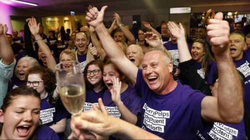 Dr Phelps's supporters celebrate her win.