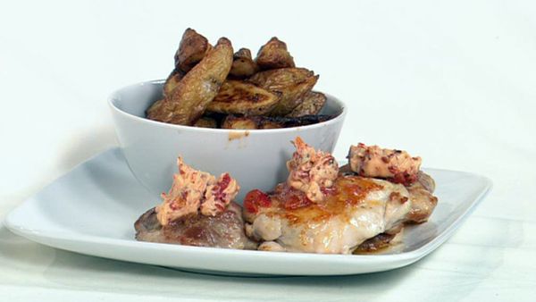 Pan-fried chicken with chilli butter and potato wedges with lemon pepper