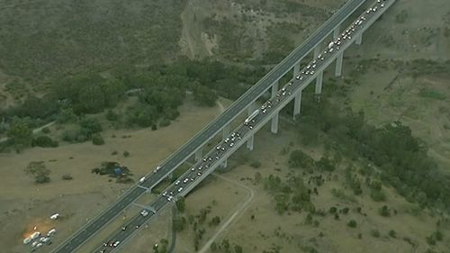 The car crashed on the EJ Whitten Bridge in Keilor East. (9NEWS)