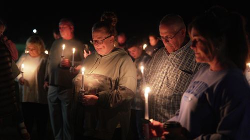 Residents attend a vigil honoring the victims of a blast at an explosives plant, Accurate Energetic Systems in Centerville, Tennessee, on October 10.