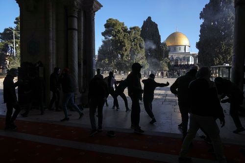 Palestinians clash with Israeli security forces at the Al Aqsa Mosque
