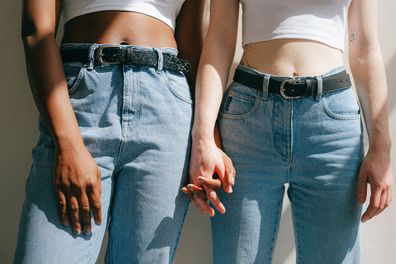 Two women holding hands