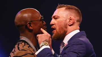 Floyd Mayweather Jr. and Conor McGregor come face to face during the Floyd Mayweather Jr. v Conor McGregor World Press Tour at SSE Arena on July 14, 2017 in London, England. (Getty)