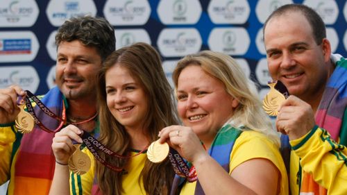 Michael Diamond (left) poses with a Commonwealth Games gold medal alongside fellow competitors Laetisha Scanlal, Stacy Roiall and Adam Vella. (AAP)