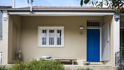 Terrace blue door facade Domain listing house RBA rate rise property