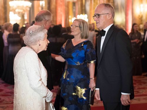 Queen Elizabeth II greets Australian Prime Minister Malcolm Turnbull and Prince Charles greets Lucy Turnbull at the CHOGM reception. (AAP)